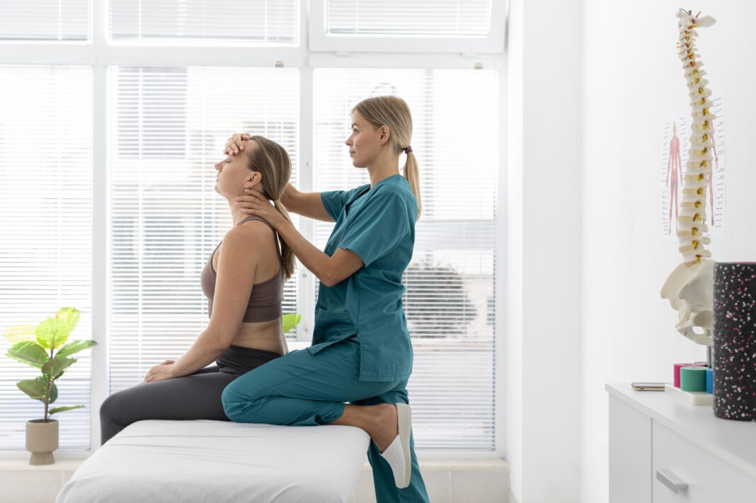 physiotherapist-helping-patient-her-clinic